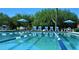 Sparkling pool with blue and white lane markers, surrounded by chairs and desert foliage at 6181 E Brilliant Sky Dr, Scottsdale, AZ 85266