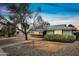 Charming single-story home showcasing desert landscaping, a brick walkway, and a well-maintained facade at 6938 E Flossmoor Ave, Mesa, AZ 85208