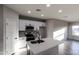 Well-lit kitchen featuring white cabinets, stainless steel appliances, and a central island with a sink at 8315 W Concordia Dr, Arizona City, AZ 85123