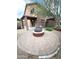 Desert backyard featuring a covered patio and built-in firepit, great for outdoor entertaining at 8339 W Molly Ln, Peoria, AZ 85383