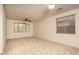 Large bedroom with neutral carpet, ceiling fan, and natural light from two windows at 8339 W Molly Ln, Peoria, AZ 85383