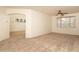 Comfortable carpeted living area with ceiling fan and light-filled window at 8339 W Molly Ln, Peoria, AZ 85383