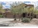 Exterior showcasing desert landscaping, three car garage, and a well-maintained front yard at 8339 W Molly Ln, Peoria, AZ 85383
