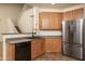 Modern kitchen with stainless steel appliances, including a refrigerator and sink at 8339 W Molly Ln, Peoria, AZ 85383