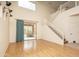 Bright living room with large sliding doors, hardwood floors, and a staircase at 8339 W Molly Ln, Peoria, AZ 85383