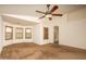 Spacious main bedroom boasts light walls and large windows with custom wood shutters at 8339 W Molly Ln, Peoria, AZ 85383