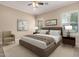 Serene bedroom with soft neutral tones, plush bedding, and bright natural light at 8367 W Lariat Ln, Peoria, AZ 85383