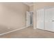 Neutral bedroom features tile flooring and closet in this bright and cozy home at 8367 W Lariat Ln, Peoria, AZ 85383