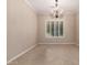 Inviting dining room with a decorative chandelier and bright window with plantation shutters at 8367 W Lariat Ln, Peoria, AZ 85383