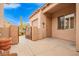 This home features an enclosed courtyard with a decorative metal gate, creating a cozy outdoor space at 8367 W Lariat Ln, Peoria, AZ 85383