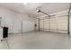 Spacious garage features lots of storage cabinets, epoxy floors, and automatic door at 8367 W Lariat Ln, Peoria, AZ 85383