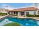 Backyard pool with tile surround, patio, and covered seating area at 8861 E Sutton Dr, Scottsdale, AZ 85260