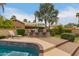 Pool and outdoor patio with lounge chair and outdoor kitchen area at 8861 E Sutton Dr, Scottsdale, AZ 85260