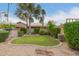 Landscaped backyard featuring a small, well-manicured lawn and mature trees at 8861 E Sutton Dr, Scottsdale, AZ 85260