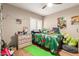 Fun bedroom with hard wood floors and plenty of wall decor at 8861 E Sutton Dr, Scottsdale, AZ 85260
