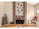 This dining room has a fireplace with a brick accent wall and an adjacent bay window at 8861 E Sutton Dr, Scottsdale, AZ 85260