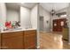 Spacious entryway with hardwood floors, a wet bar, and a grand double door entry at 8861 E Sutton Dr, Scottsdale, AZ 85260