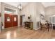 Inviting entryway with hardwood floors, chandelier lighting, and double door entry at 8861 E Sutton Dr, Scottsdale, AZ 85260