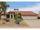 Charming single-story home featuring a well maintained landscaped yard and an attached three-car garage at 8861 E Sutton Dr, Scottsdale, AZ 85260