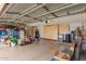 Spacious garage with ample storage cabinets, sink, and refrigerator at 8861 E Sutton Dr, Scottsdale, AZ 85260