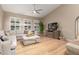 Light filled living room with a vaulted ceiling and plenty of room for entertaining at 8861 E Sutton Dr, Scottsdale, AZ 85260