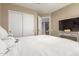 Comfortable main bedroom featuring a plush bed, closet, and doorway leading to the rest of the house at 8861 E Sutton Dr, Scottsdale, AZ 85260