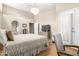 Serene main bedroom offers hardwood floors, a private entry, and ensuite bathroom at 8861 E Sutton Dr, Scottsdale, AZ 85260