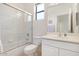 A bright bathroom featuring a shower-tub combo with white tiling and a modern vanity at 9608 E Nacoma Dr, Sun Lakes, AZ 85248