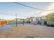A large backyard featuring a shimmering pool, and artistic murals on the block wall at 9834 N 1St St, Phoenix, AZ 85020
