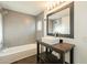 Stylish bathroom with gray tile surround and a unique vanity at 9834 N 1St St, Phoenix, AZ 85020