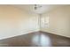 Bright, well-lit bedroom featuring wood-look tile, neutral paint and a ceiling fan at 9834 N 1St St, Phoenix, AZ 85020