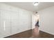 Spacious bedroom with built in cabinets and wood look tile at 9834 N 1St St, Phoenix, AZ 85020