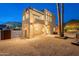 Modern stucco home with a cantilevered balcony and desert landscaping at 9834 N 1St St, Phoenix, AZ 85020