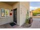 Close-up of the front entrance highlighting the house number, modern door, and desert-friendly landscaping at 9834 N 1St St, Phoenix, AZ 85020