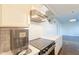 Updated kitchen with stainless steel appliances, quartz countertops, and sleek subway tile backsplash at 9834 N 1St St, Phoenix, AZ 85020