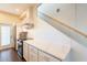Stylish kitchen features stainless appliances, white cabinets, subway tile backsplash and quartz countertops at 9834 N 1St St, Phoenix, AZ 85020