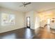 Bright and airy living room featuring tile floors, a ceiling fan, and an open layout with seamless access to the kitchen at 9834 N 1St St, Phoenix, AZ 85020