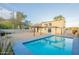 Inviting pool with blue trim sits in a large backyard, perfect for relaxation and outdoor fun at 9834 N 1St St, Phoenix, AZ 85020