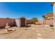 The backyard offers a shed for storage, complemented by tasteful landscaping and neutral color tones at 995 E Vernoa St, San Tan Valley, AZ 85140
