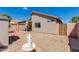 A spacious backyard features a shed, fountain, and plenty of room to relax or entertain guests at 995 E Vernoa St, San Tan Valley, AZ 85140