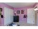 Bedroom with lavender walls, double closets, and themed wall decor at 995 E Vernoa St, San Tan Valley, AZ 85140