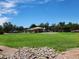 A spacious community park with a playground, picnic area, and vast grassy field for recreation at 995 E Vernoa St, San Tan Valley, AZ 85140