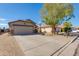 Charming single-story home with a long driveway and well-kept landscaping at 995 E Vernoa St, San Tan Valley, AZ 85140