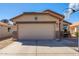 Single Gathering home featuring an attached two car garage and basketball hoop over the driveway at 995 E Vernoa St, San Tan Valley, AZ 85140