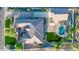An aerial view reveals the layout of this property, highlighting the pool, green spaces, and ample parking at 10059 W Villa Lindo Dr, Peoria, AZ 85383