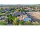 Expansive property featuring lush landscaping, a sparkling pool, and mountain views in a vibrant community setting at 10059 W Villa Lindo Dr, Peoria, AZ 85383