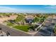 Aerial view of a meticulously landscaped property featuring lush lawns and mature trees in a residential area at 10059 W Villa Lindo Dr, Peoria, AZ 85383