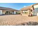 The covered outdoor kitchen has stone columns and an extended countertop space at 10059 W Villa Lindo Dr, Peoria, AZ 85383
