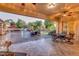 Serene backyard with an outdoor seating area and lush greenery at 10059 W Villa Lindo Dr, Peoria, AZ 85383