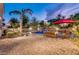 Scenic backyard featuring a sparkling pool, rock waterfall, and ample patio space for outdoor entertaining at 10059 W Villa Lindo Dr, Peoria, AZ 85383